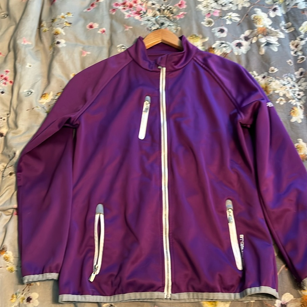 Purple ladies golf jacket from stormpack in size medium.